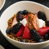 Chia Muesli · Almond Milk Soaked Chia Seeds, Rhubarb Compote, Granola, Fresh Berries, Yogurt, Honey.