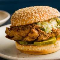 Fried Chicken Burger · Buttermilk Marinated Chicken, Spicy Mayo, Pickles & Coleslaw On A Sesame Seed Bun.