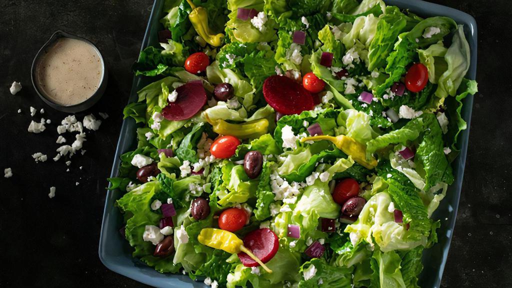 Greek Salad · Lettuce, feta, beets, grape tomatoes, Greek olives, red onions & pepperoncini. Small serves up to 2. Medium serves up to 3. Party size serves up to 15.