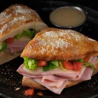 Ham And Cheese Deli Boat · Calzone style sandwich baked with pizza dough stuffed with ham, provolone, lettuce & tomatoe...