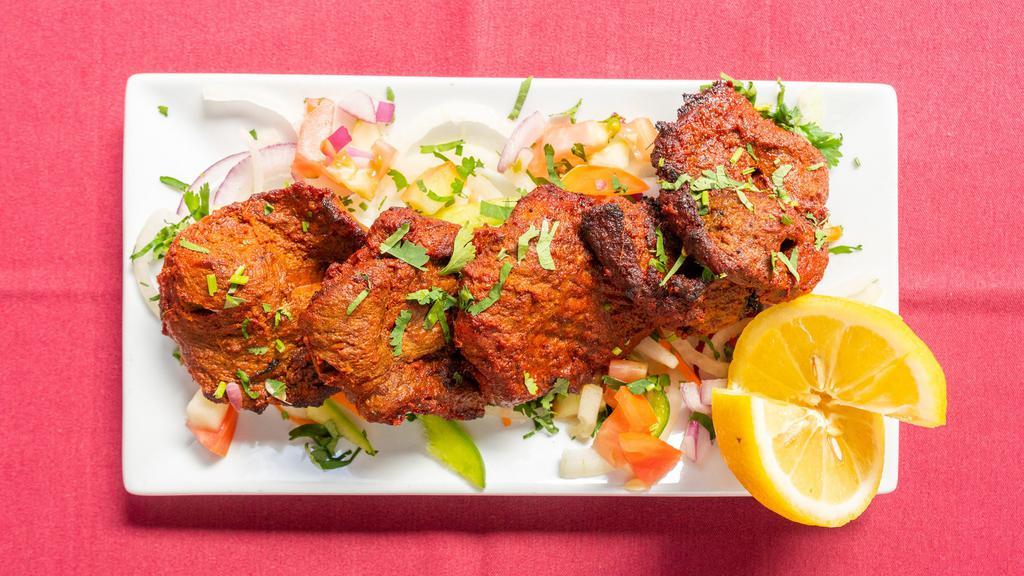 Boti Kebab · Pieces of lamb with robust spices marinated and slow grilled in a clay oven.