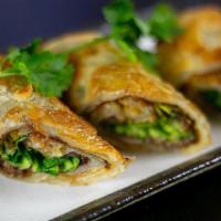 Beef Pancake Wrap · hand-kneaded crispy scallion pancake wrapped around tender braised beef shank . with our spe...