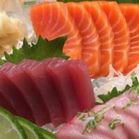 Tricolor Sashimi · Six pieces of tuna, six pieces of salmon, and six pieces of yellowtail.