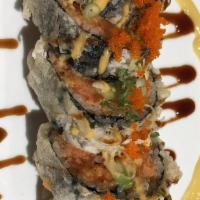 Spider Roll · Deep fried soft shell crab, avocado and cucumber wrapped inside.