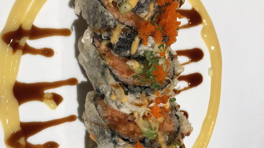 Spider Roll · Deep fried soft shell crab, avocado and cucumber wrapped inside.