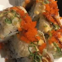 Dynamite Roll · Spicy yellowtail, spicy salmon, and avocado wrapped inside, topped with lobster salad and to...