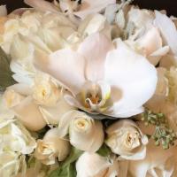 Classic White · Classic White Flower Arrangement is a classic combination of white hydrangea, roses and orch...