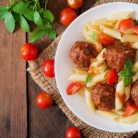 Penne Meatballs · Savory meatballs, sauteed mushrooms, and parmesan cheese smothered in homemade marinara on a...