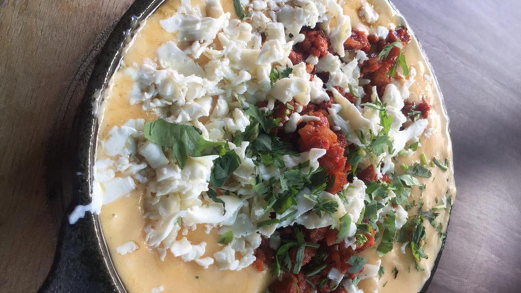 Queso Fundido · Four melted Mexican cheese fondue.