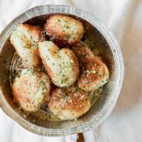 Garlic Knots (6 Pcs) · Comes with one marinara sauce.