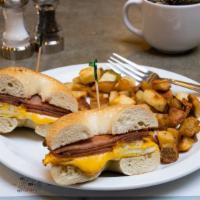 Classic Pork Roll Sammy · Toasted plain bagel, loaded with grilled Taylor pork roll, two over hard eggs & American che...