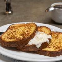 Grand French · Thick sliced brioche cooked in our own batter of vanilla, whipped eggs, brown sugar, cinnamo...