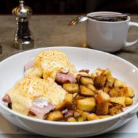 Classic Benedict · A toasted English muffin with slices of Virginia ham, plum tomato and two poached eggs, then...