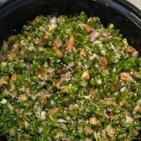 Tabouli Salad · Curly parsley, tomatoes, red onions, with olive oil. & lemon juice topped with bulgur wheat.