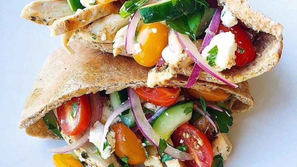 Chicken Greek Pita · Grilled chicken & a Greek salad (Lettuce, tomatoes, red roasted peppers,. cucumbers, Greek feta cheese & Kalamata olives drizzled W/ balsamic vinaigrette dressing), all stuffed inside a pita.