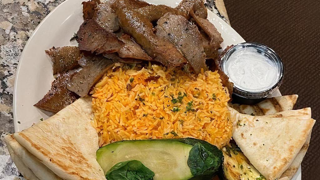 Gyro  Entree · Your choice of Classic or Chicken Gyro served with basmati rice, our grilled vegetable mix, pita bread, dipping sauce and side salad