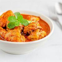 Curry Chicken · A flavorful, traditional dish made of juicy chicken, seasoned with Jamaican curry powder, fr...