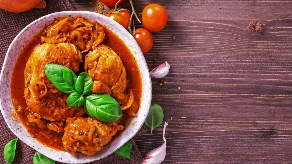 Stew Chicken · A flavorful, traditional dish made of juicy, tender pieces of chicken, fried and further stewed in a savory sauce, served with your choice of two sides.