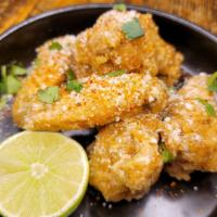 Elote Style Wings · Crispy Fried Wings, Mexican Spice Sour Cream, Cilantro, Cotija.
