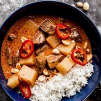 Massaman Curry · Massaman curry,  chicken,  served with rice.