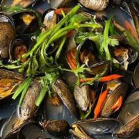 Mussel Soup · Fresh shellfish with clear soup hinted with a kick of jalapeños.