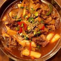 Beef Brisket Rice Cake · Stir-fried Beef brisket, assorted vegetables, and rice cake in our homemade soy-based sauce....