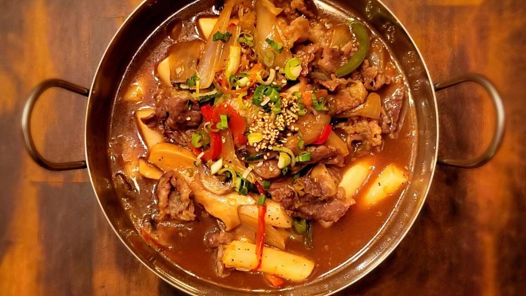 Beef Brisket Rice Cake · Stir-fried Beef brisket, assorted vegetables, and rice cake in our homemade soy-based sauce. Perfect For those who would prefer a non-spicy rice cake dish with beef.