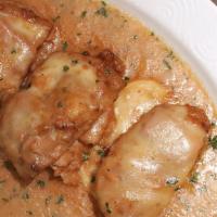 Veal Sorrentino · Topped with prosciutto, eggplant & mozzarella served with a side of linguini