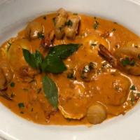 Lobster Ravioli · Lobster filled ravioli topped with scallops and shrimp in a pink brandy sauce