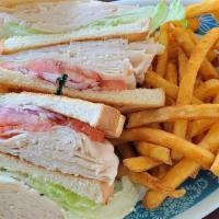 Turkey Club Sandwich · Served with French Fries