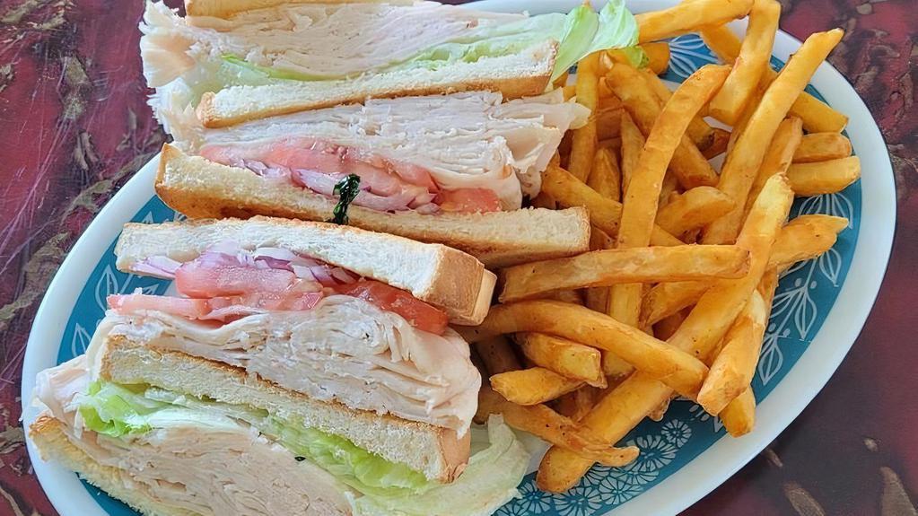 Turkey Club Sandwich · Served with French Fries