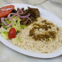 Curry Goat Meal · Curry Goat meat, with your choice of rice and peas or white rice, fried plantains, and salad.