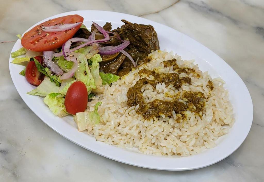 Curry Goat Meal · Curry Goat meat, with your choice of rice and peas or white rice, fried plantains, and salad.