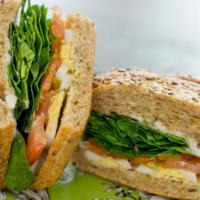 Eggology · 100% organic. Hard-boiled egg, tomatoes, sunflower sprouts, baby spinach, veganaise on a bri...