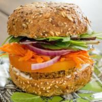 Hemp Sunshine Burger · Vegan. 100% organic.  Quinoa, red lentils, sunflower seeds and hemp seeds. Served on a bun w...