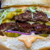 Smash Burger · Smashed Patty, American Cheese, Lettuce, Red Onion, Pickles, Fancy Sauce