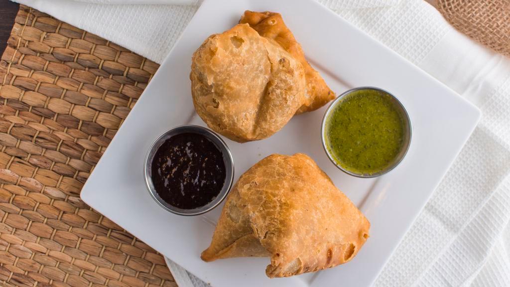 Vegetable Samosa (2 Pieces) · Phyllo pastry triangle, potato and green pea filling.