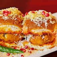 Vada Pav (2 Pcs) · Batter fried spicy potato dumpling served in bun with sweet date chutney and spicy garlic ch...