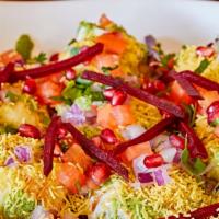 Sev Puri · Crispy puris topped with assorted chutneys and sev