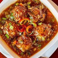 Manchurian Gravy · Deep fried vegetable dumplings, simmered in Indo-Chinese spices gravy