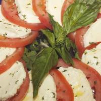 Caprese Salad · Spring mix, tomatoes, and fresh mozzarella.