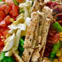 Cobb Salad · Grilled chicken, bacon, hard-boiled egg, tomatoes, mixed cheese & blue cheese crumbles.