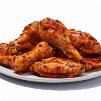 Naked Wings (8 Pieces) · 624 cal. per serving. Traditional, no breading, tossed in your favorite sauce or rub. It’s m...