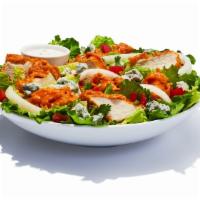 Buffalo Chicken Salad · Spring mix greens stacked with breaded chicken tossed in your favorite wing sauce. Topped wi...