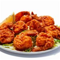 Buffalo Shrimp (12 Pieces) · Hand-breaded shrimp tossed in your favorite wing sauce. Tender inside, crispy outside. 34 ca...