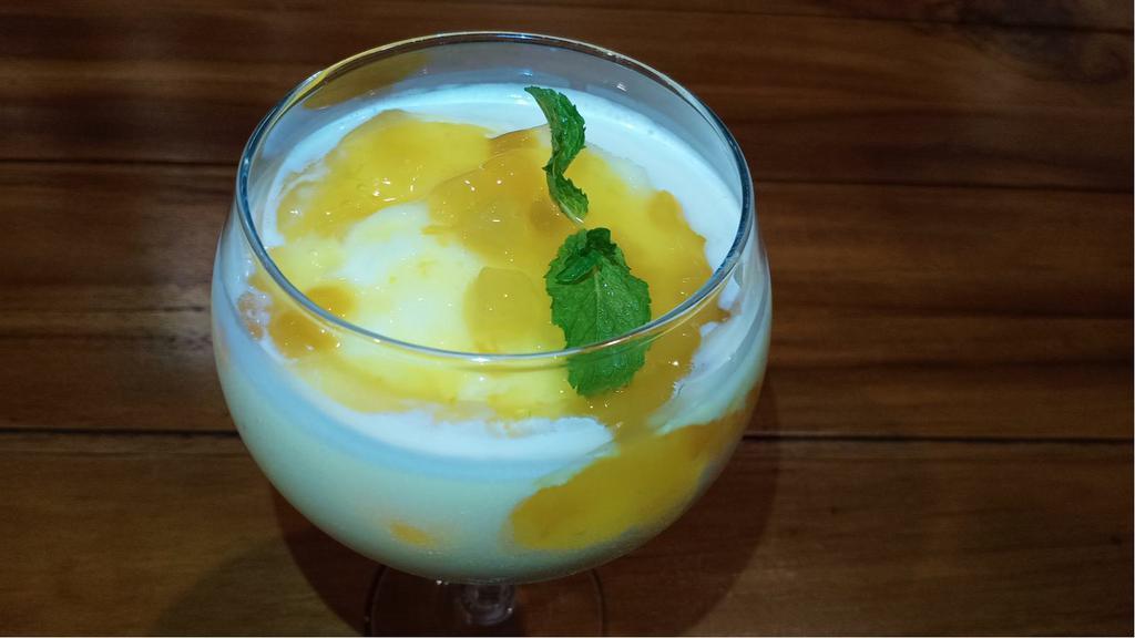 Mango Tango Smoothie · Refreshing blend of strawberry, mango, banana, and mango juice.