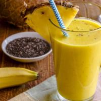 Tropical Smoothie · Refreshing blend of pineapple, banana, mango, coconut, frozen yogurt, and apple juice.