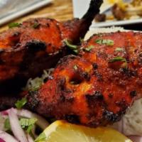 Tandoori Chicken · Gluten free. Farm raised, on the bone, marinated, and skewered. Served on a bed of rice with...