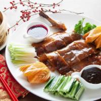 Peking Duck (Half) · A Chinese delicacy. Roasted duck characterized by its thin, crispy skin and tender meat, pro...