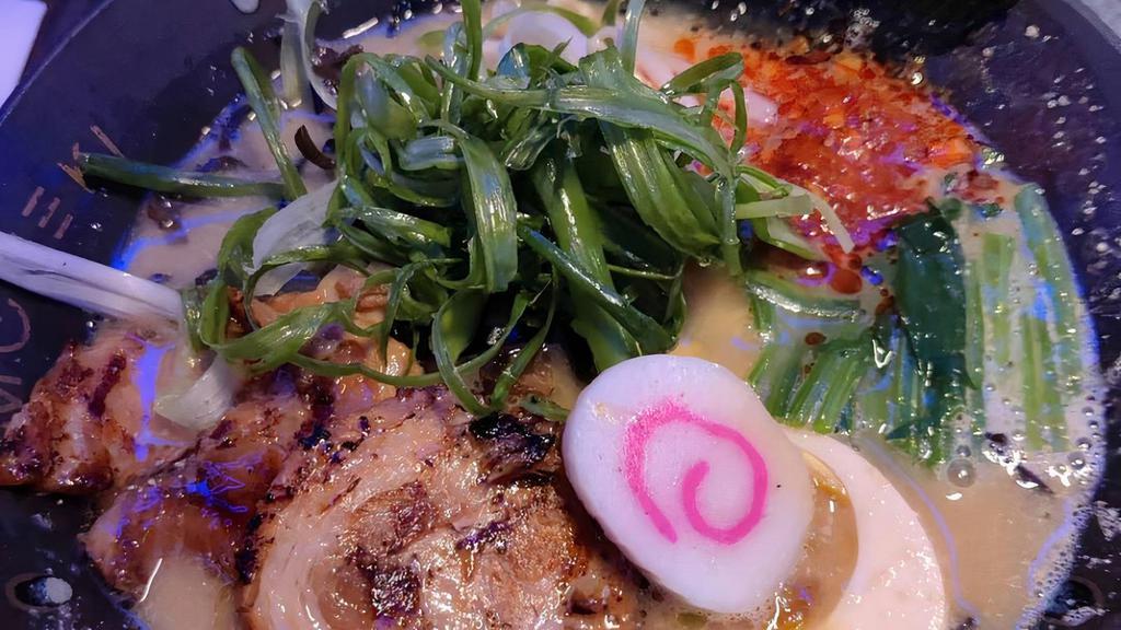 Volcano Miso Ramen · Spicy. Wavy noodles in the spicy miso broth, pork chashu, beans sprouts, bamboo shoots, kikurage mushrooms, butter corn, scallion, seasoned egg, fish cake, nori, and spinach.